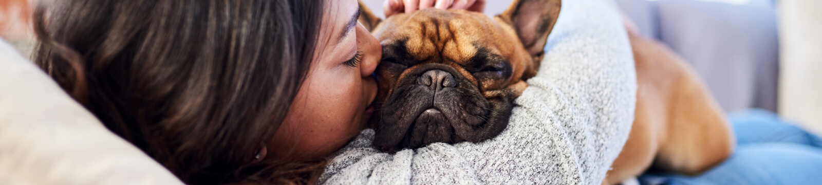 Woman hugging dog