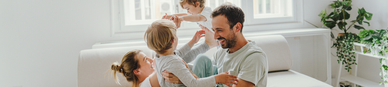 Young, happy family in home